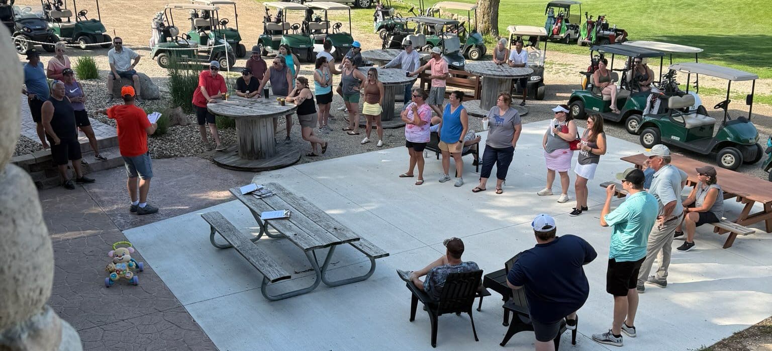 Large group gathered on the patio for a corporate golf outing